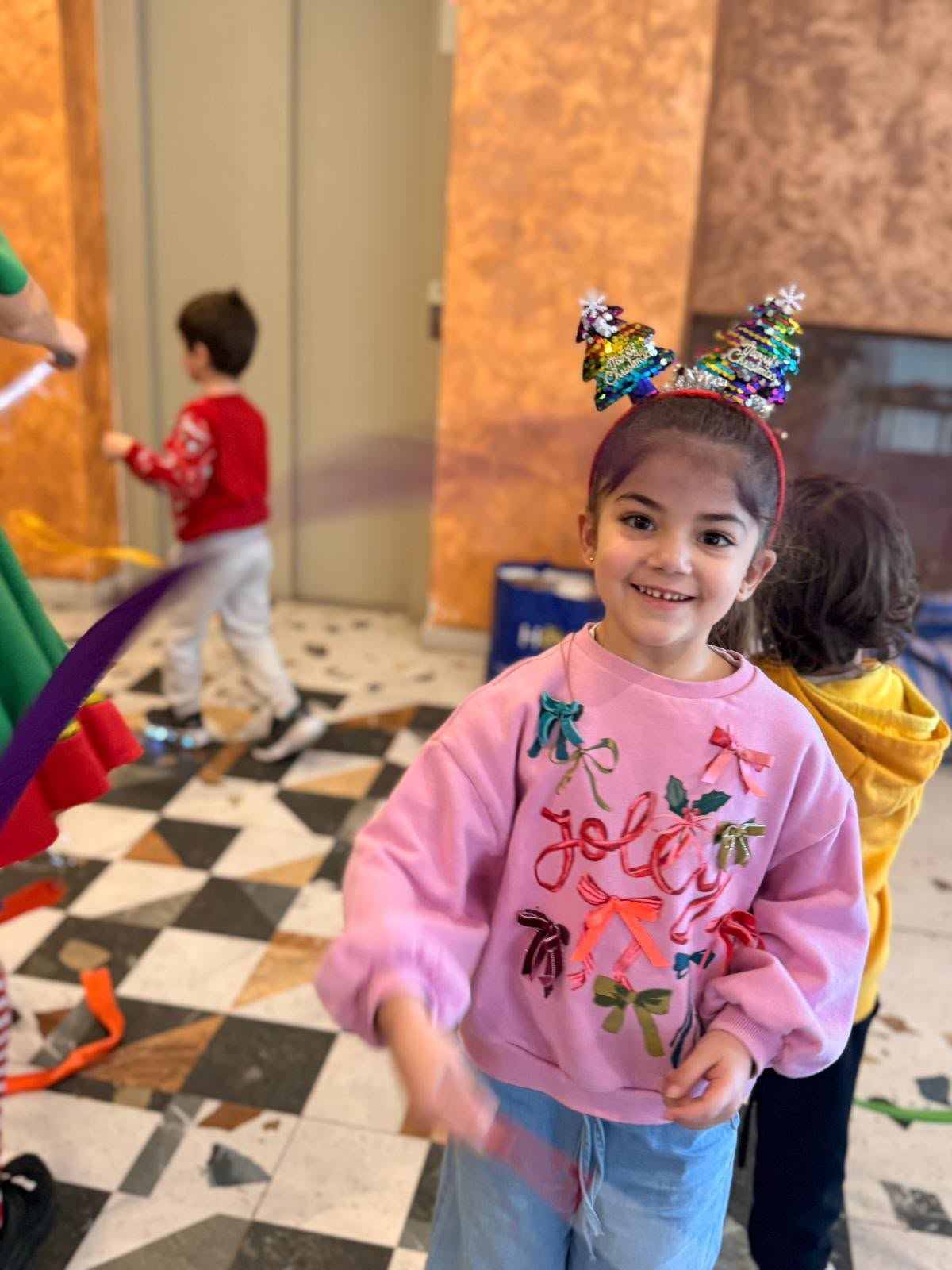 A child dancing in the big play hall