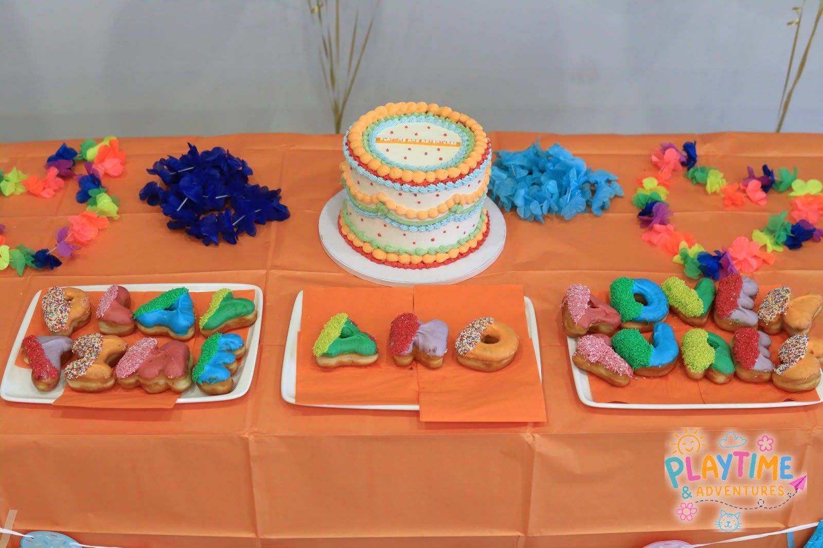 The Summer Party cake and letter doughnuts