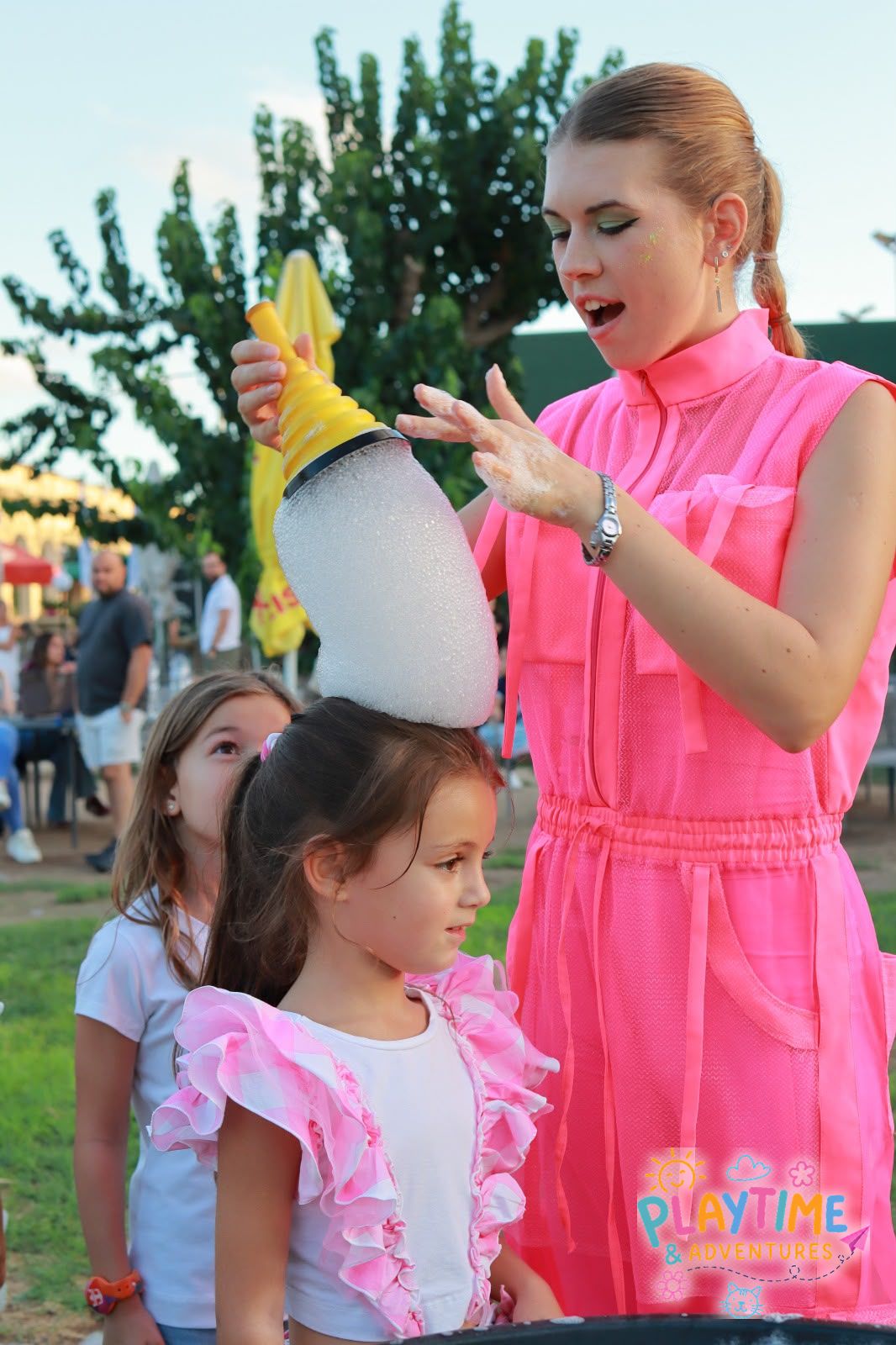 A foam bubble tower on a little girl's head